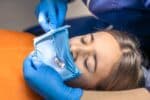 a lady is getting sedation dentistry treatment