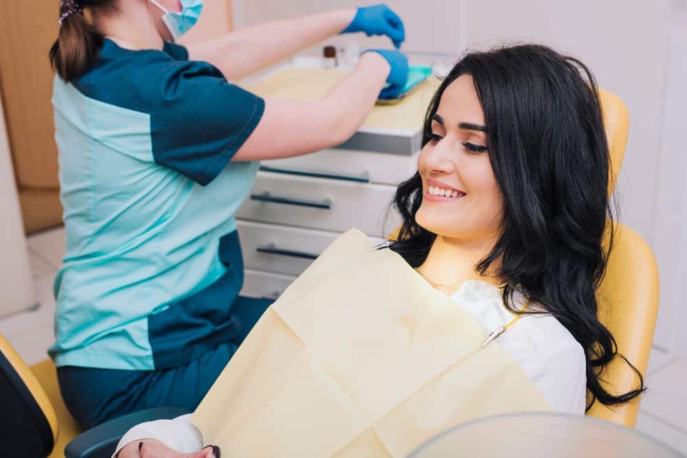 a lady visits dental clinic for restorative dentistry treatment
