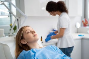 a lady is getting latest sedation dental treatment
